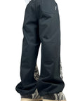 BLACK RUBBER FLOWERS PANTS